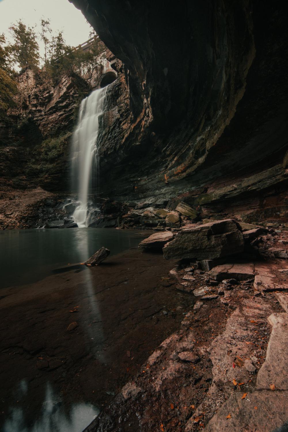 Concaved Rock Face By Waterfall Photo Concaved Rock Face By Waterfall Photo