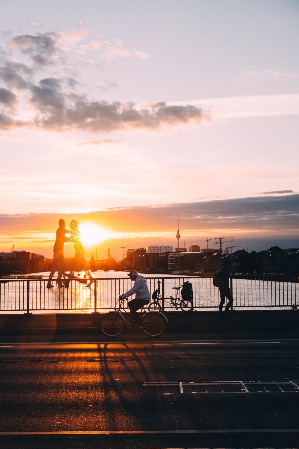 Sunset Glares Over Water By A Bridge Photo Sunset Glares Over Water By A Bridge Photo