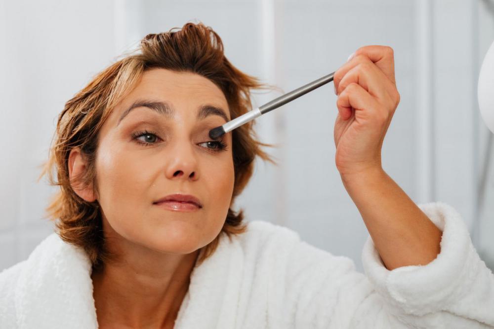 Skincare routine - Middle-Aged Woman in Bathroom Skincare routine - Middle-Aged Woman in Bathroom