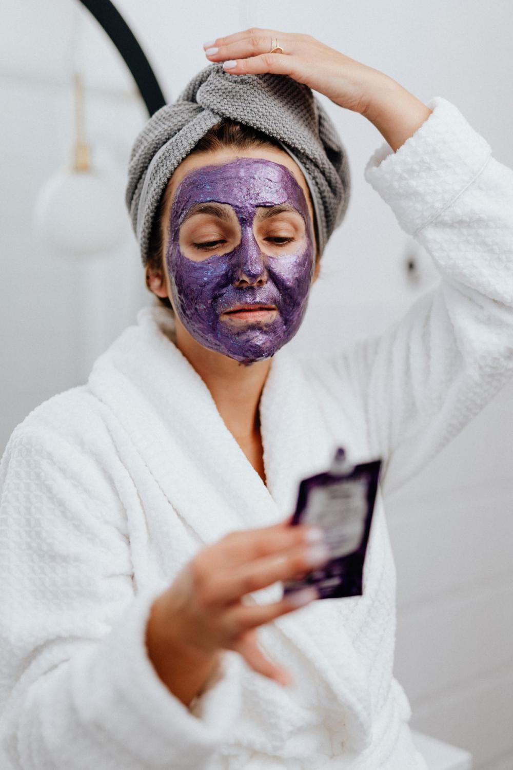 Skincare routine - Middle-Aged Woman in Bathroom Skincare routine - Middle-Aged Woman in Bathroom