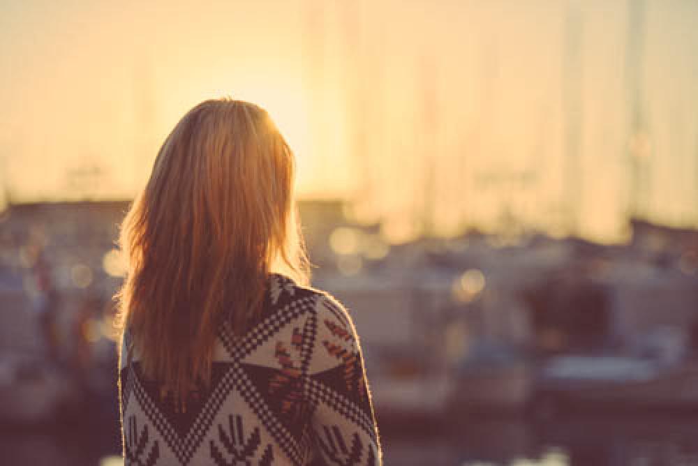 Blond Girl Thoughfully Watching A Sunrise Blond Girl Thoughfully Watching A Sunrise