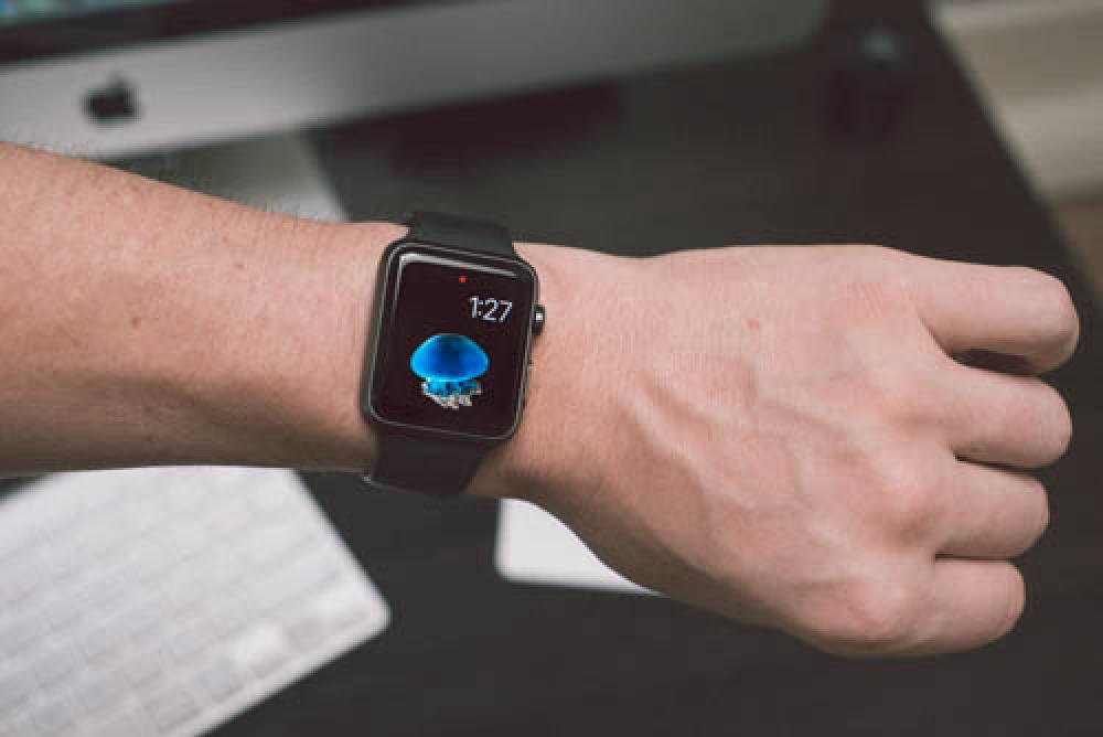 Apple Sport Watch Black On Mans Wrist In An Office Apple Sport Watch Black On Mans Wrist In An Office
