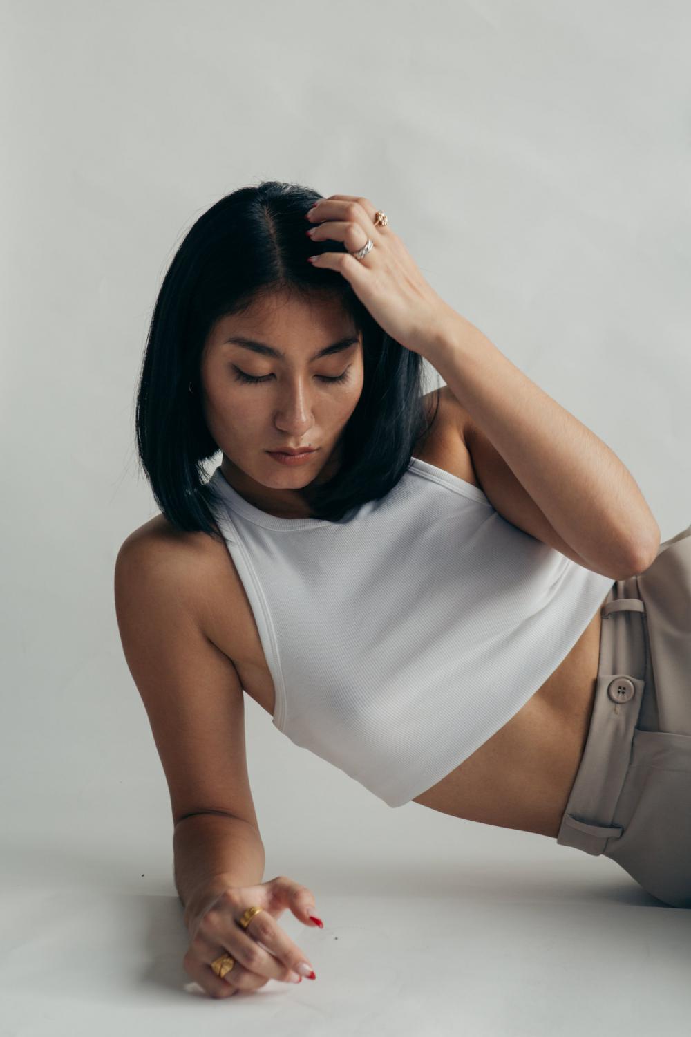 Woman In Cropped White Vest Top Photo Woman In Cropped White Vest Top Photo