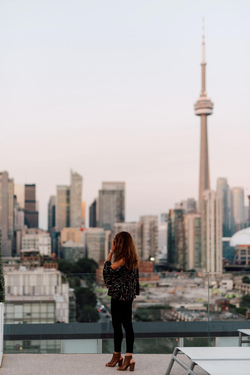A Woman Looking Out At Toronto Photo A Woman Looking Out At Toronto Photo