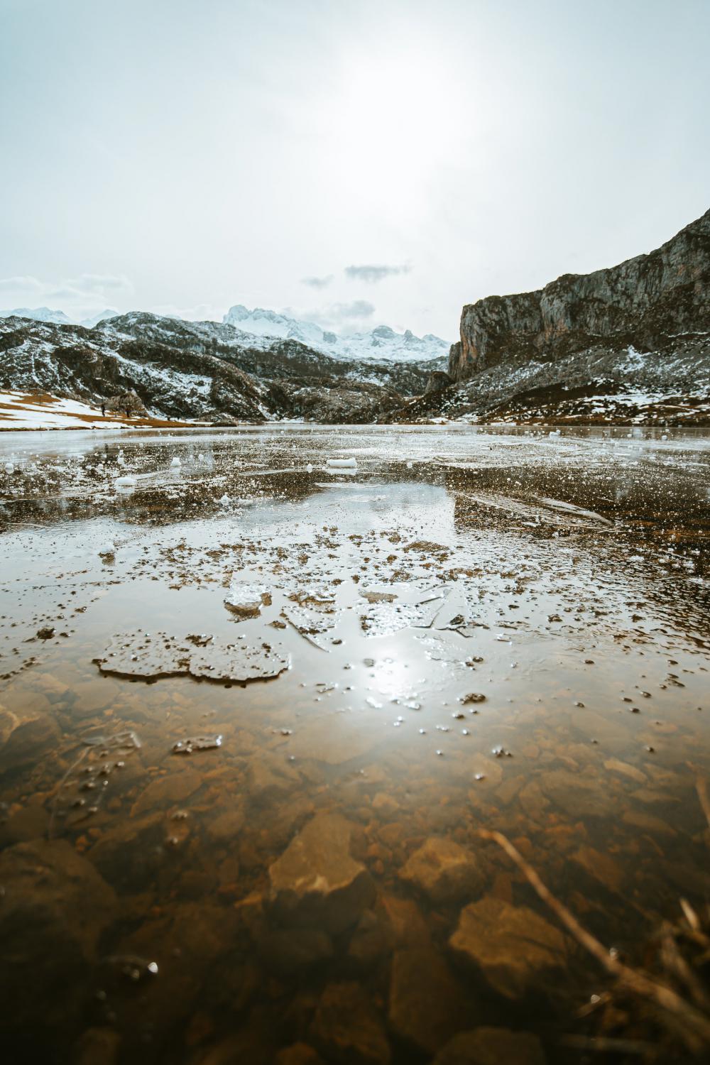 Icy Lake And Frozen Mountains Behind Photo Icy Lake And Frozen Mountains Behind Photo