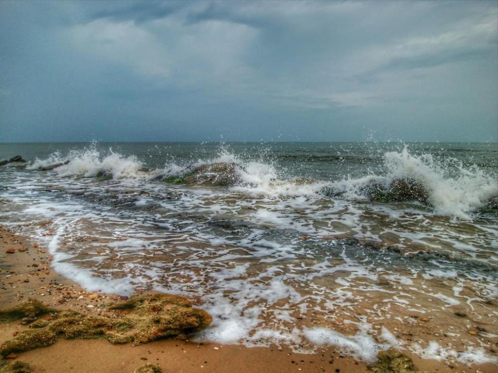 Sea waves crashing on rocks and cloudy sky Sea waves crashing on rocks and cloudy sky