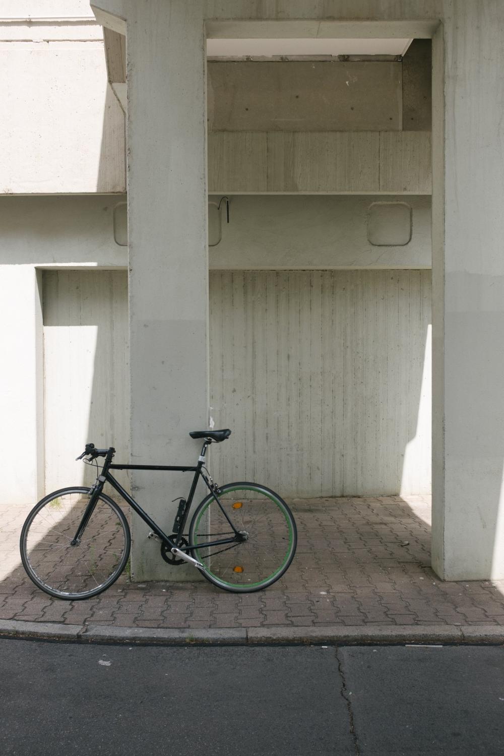 Bike Sits Against Concrete Column Photo Bike Sits Against Concrete Column Photo