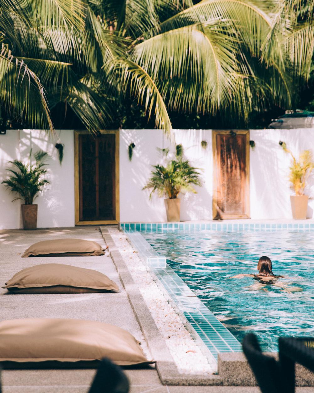 Person Swimming In Clear Pool Photo Person Swimming In Clear Pool Photo