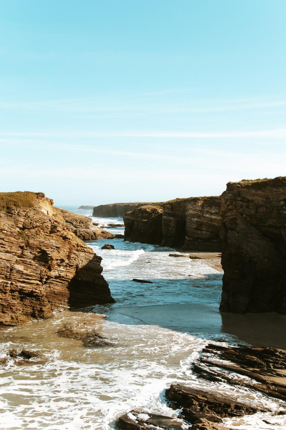 Cliffs Form Shadows By The Sea Photo Cliffs Form Shadows By The Sea Photo