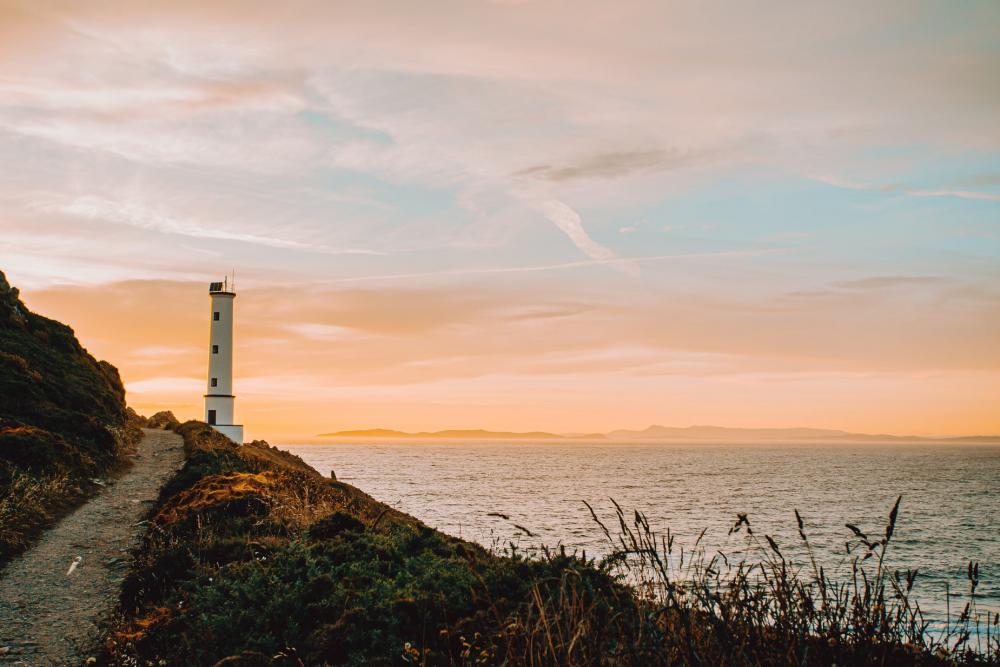 Beacon Nestled At The Edge Of A Cliff Photo Beacon Nestled At The Edge Of A Cliff Photo