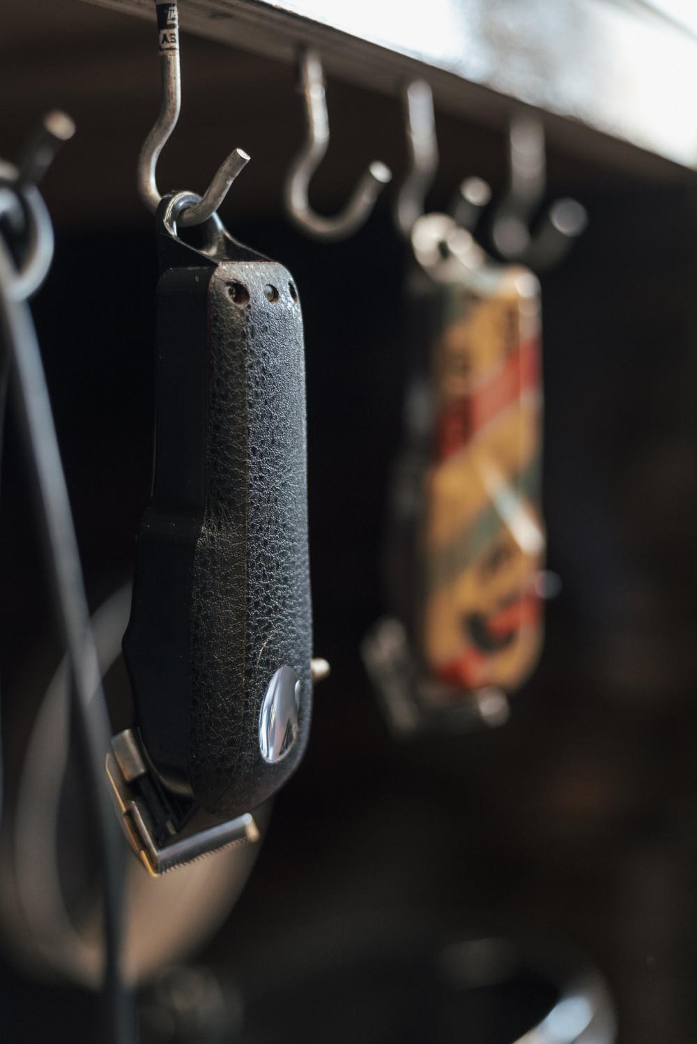 Barber Hair Trimmers Hang Up On Hooks Photo Barber Hair Trimmers Hang Up On Hooks Photo