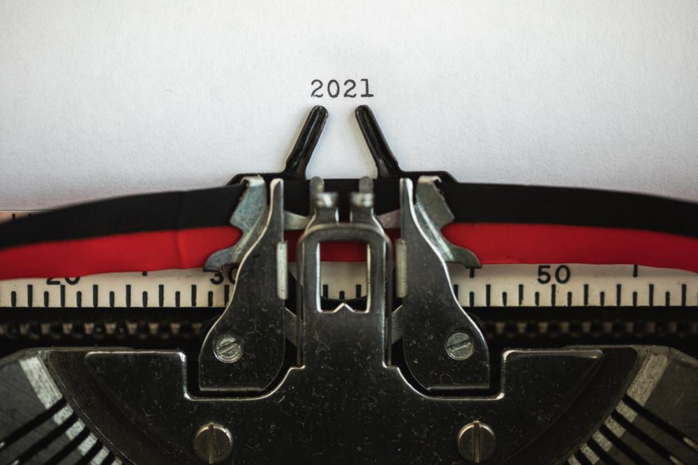 Typewriter Holds Papers With The Numbers 2021 Photo Typewriter Holds Papers With The Numbers 2021 Photo