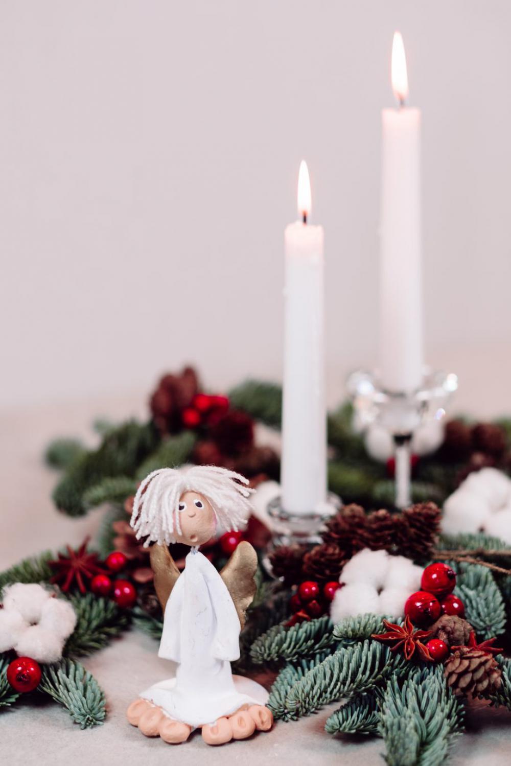 Christmas spruce decoration with candles and an angel Christmas spruce decoration with candles and an angel