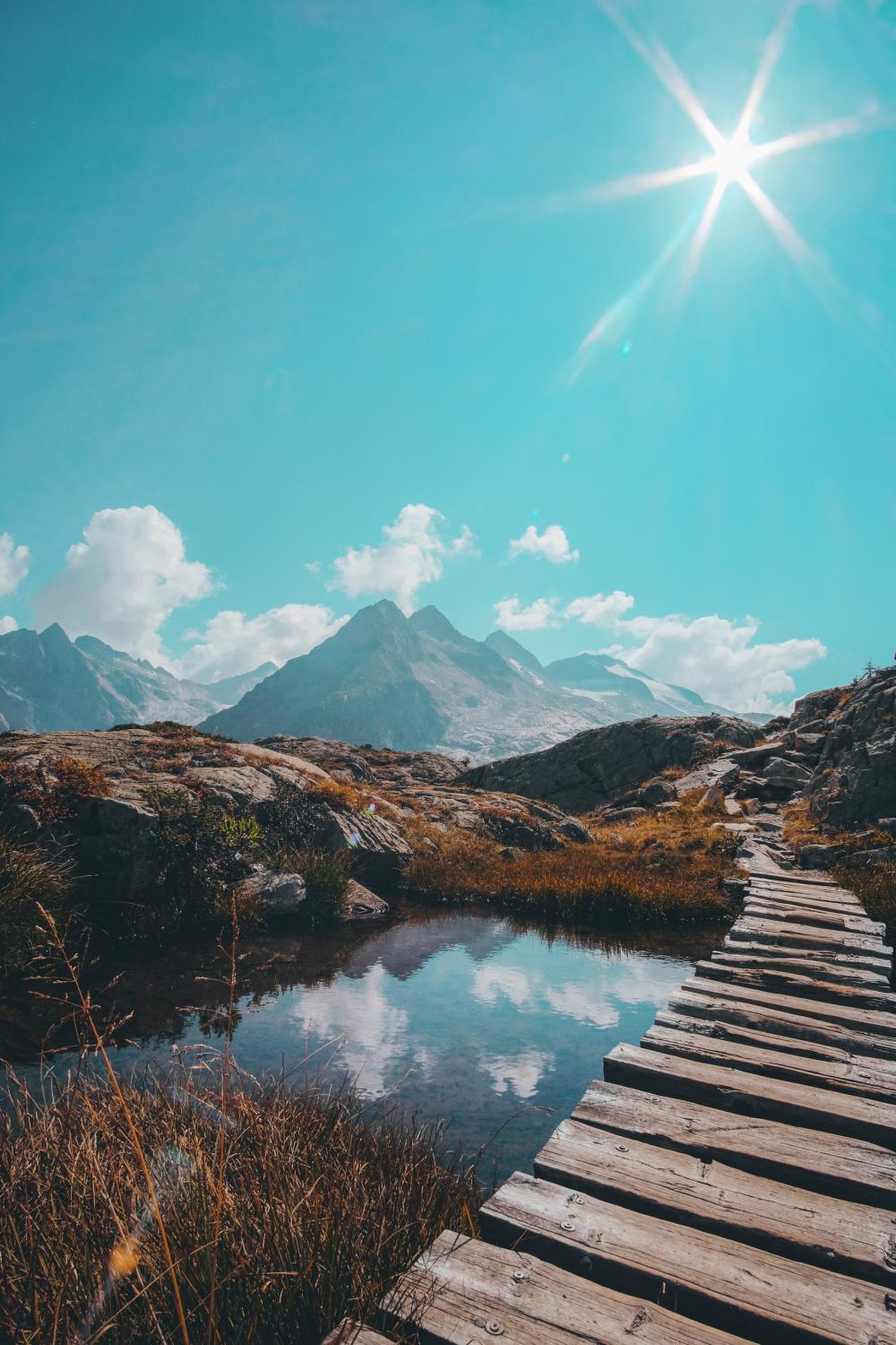 Wooden Walkway Over Water Into Rocky Mountain Pathway Photo Wooden Walkway Over Water Into Rocky Mountain Pathway Photo
