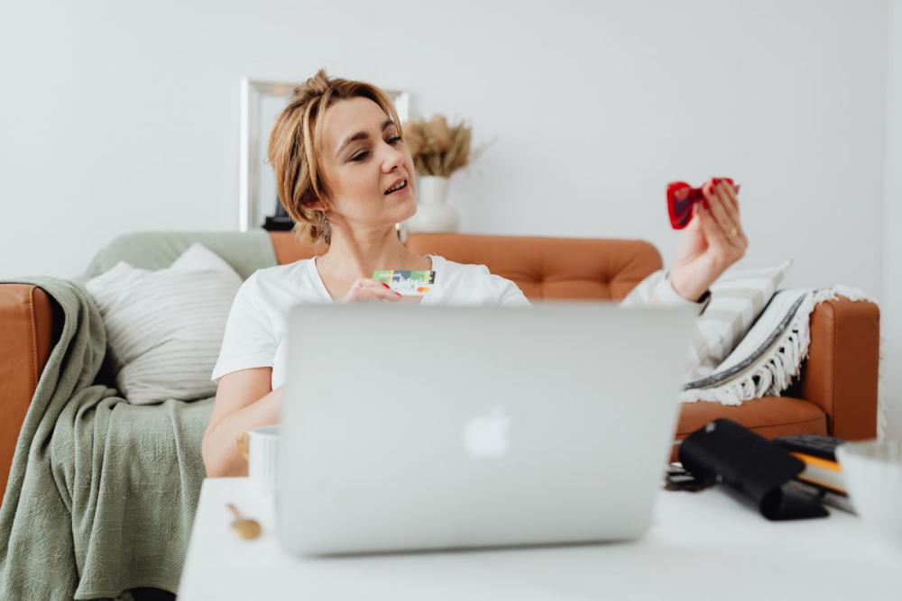 Woman working online e-commerce shopping at her home Woman working online e-commerce shopping at her home