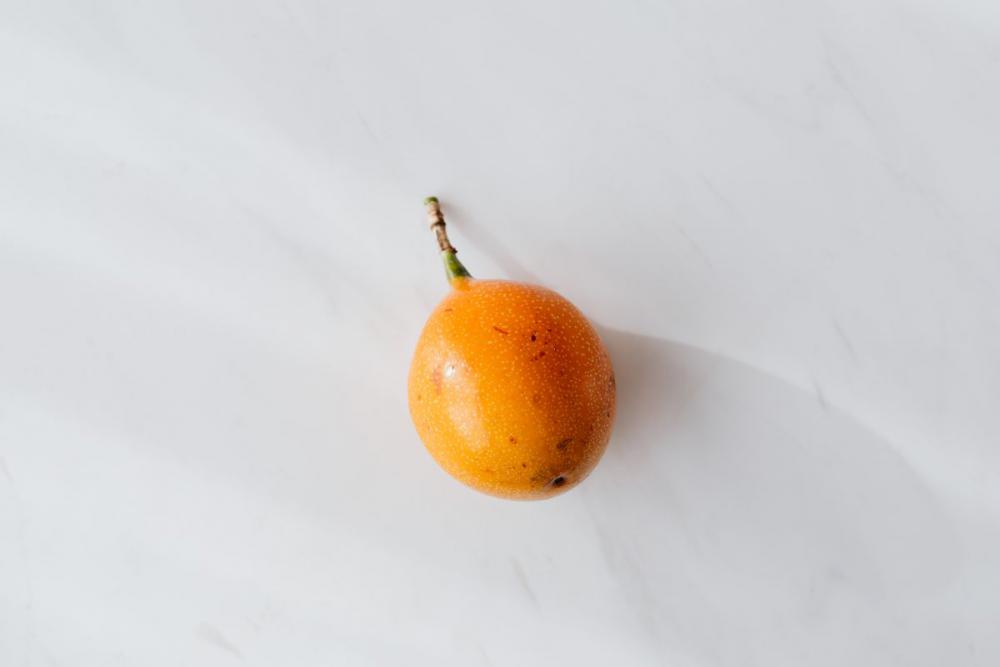 Passion fruit on the white table Passion fruit on the white table