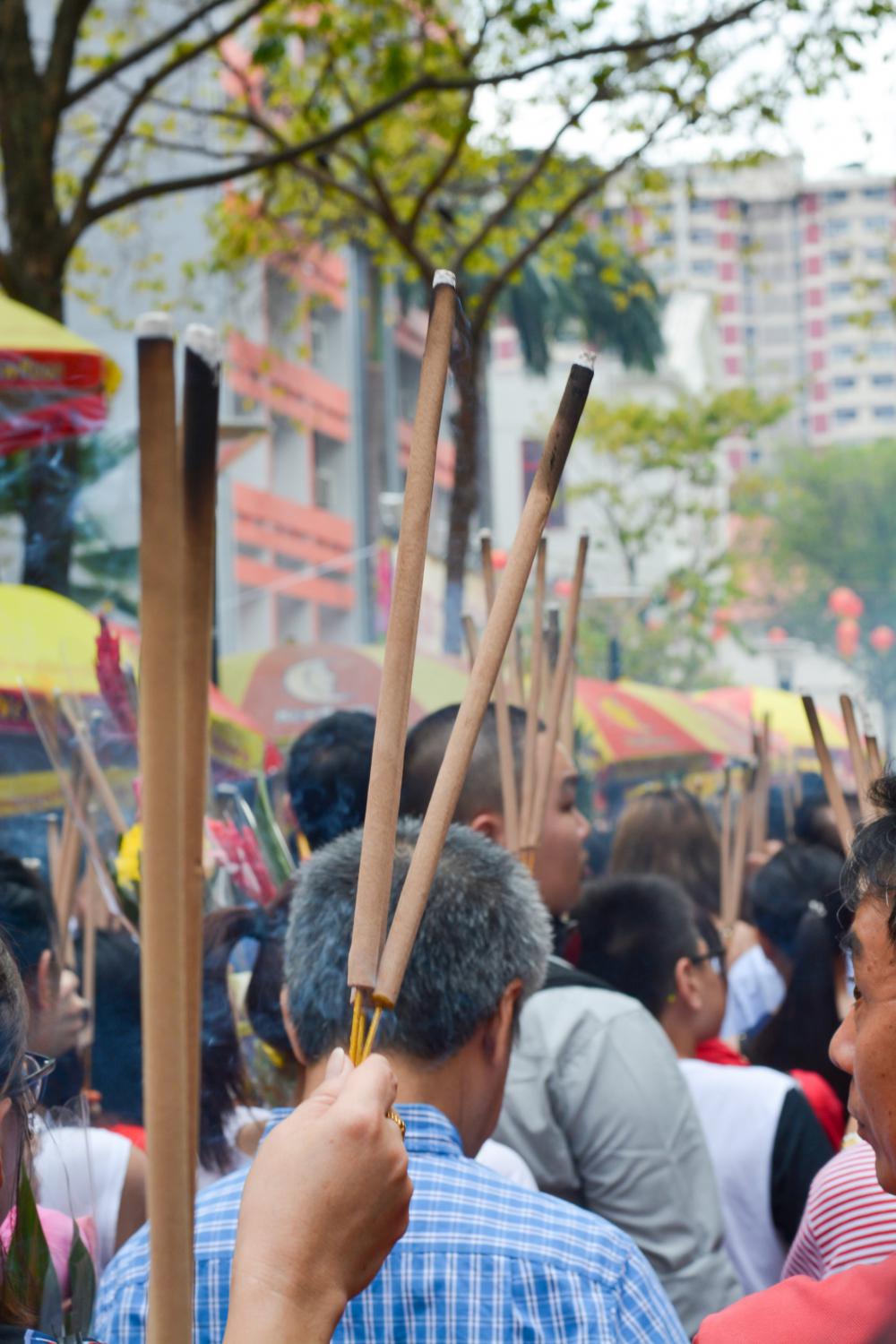 Street Full Of People Holding Long Sticks With Burnt Ends Photo Street Full Of People Holding Long Sticks With Burnt Ends Photo
