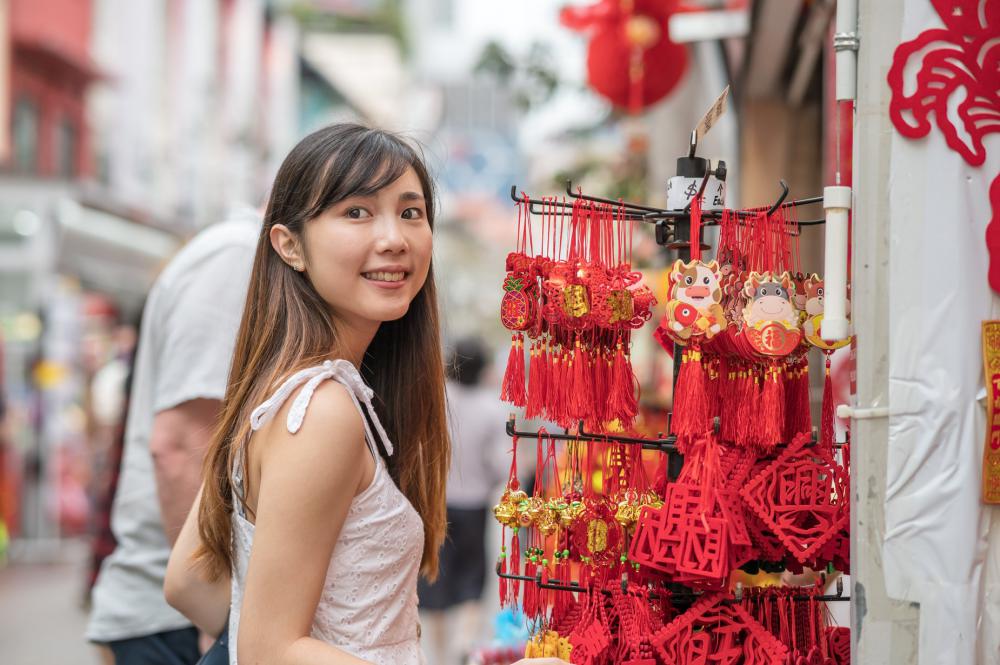 Person Smiles While Shopping At A Outdoor Market Photo Person Smiles While Shopping At A Outdoor Market Photo
