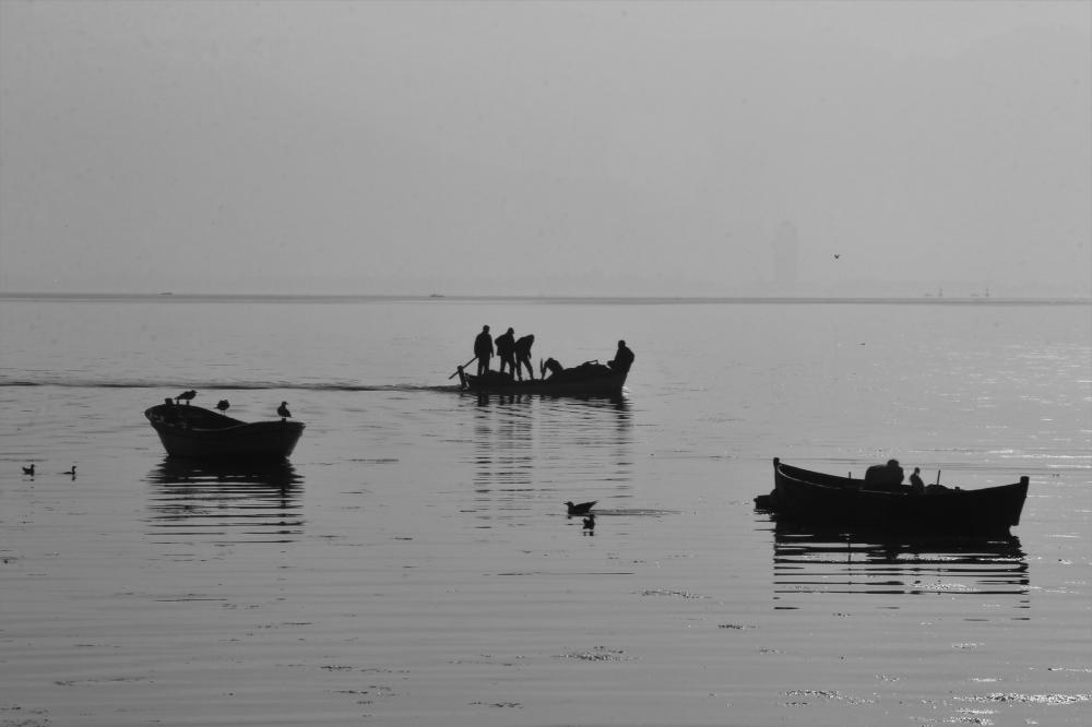 Three Boats With People In Still Water Photo Three Boats With People In Still Water Photo