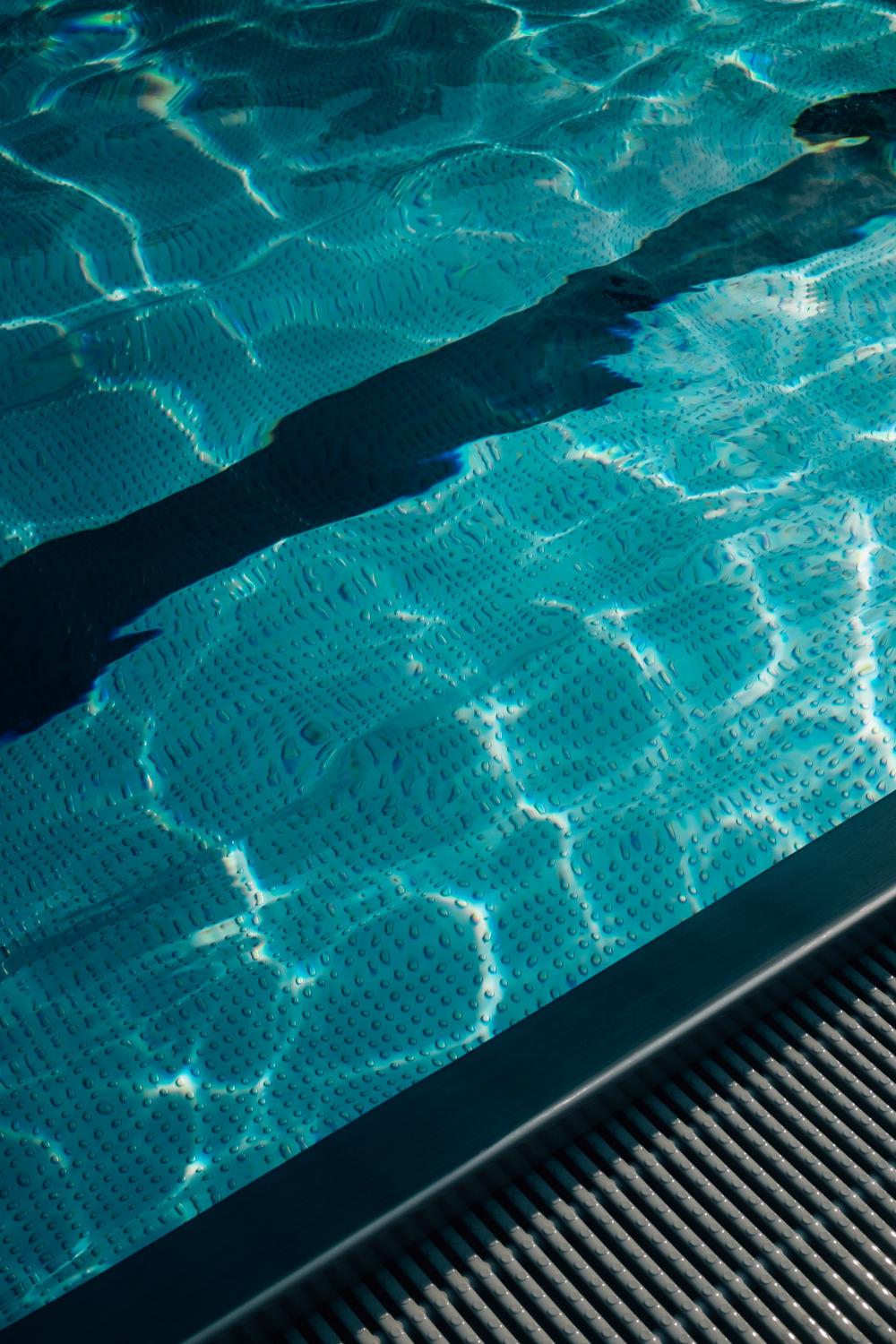 Blue Wavy Water Of A Swimming Pool Photo Blue Wavy Water Of A Swimming Pool Photo