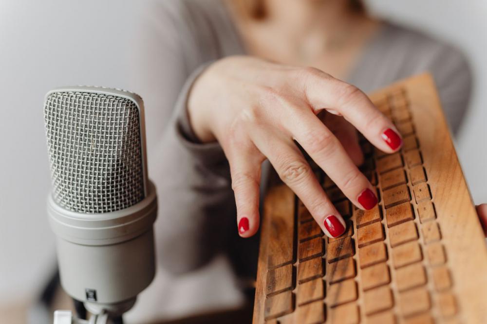 Woman Recording ASMR Sounds On Microphone Woman Recording ASMR Sounds On Microphone