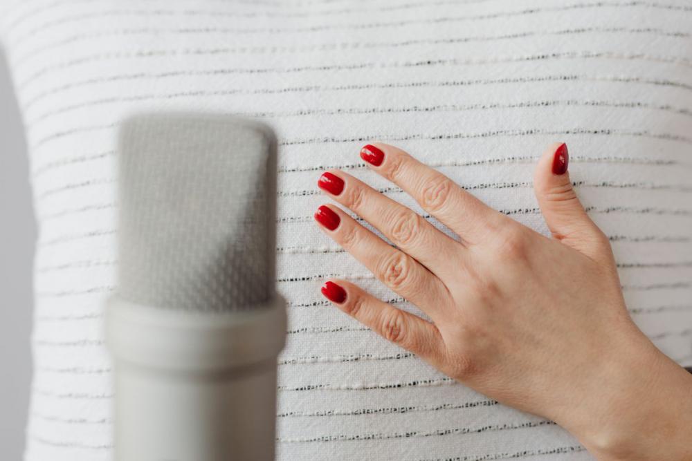 Woman Recording ASMR Sounds On Microphone Woman Recording ASMR Sounds On Microphone