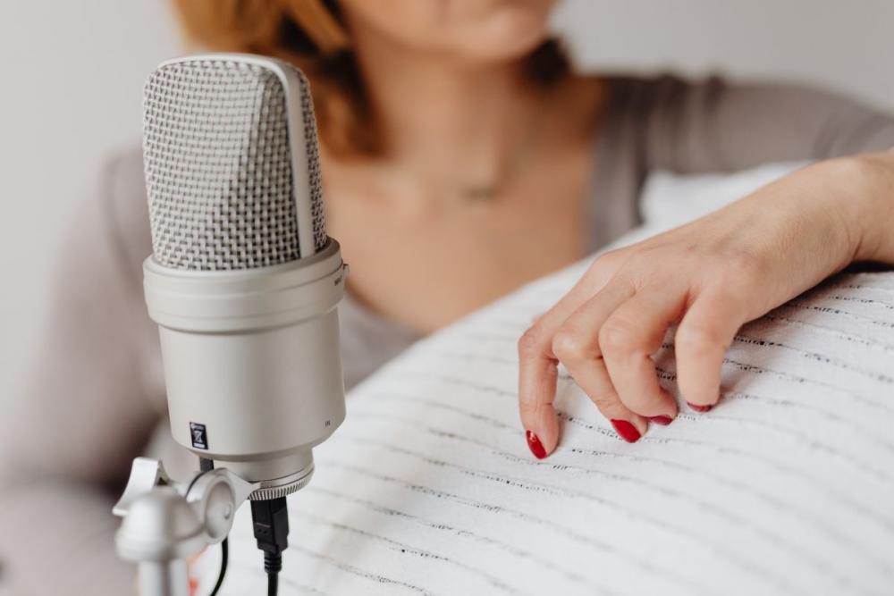 Woman Recording ASMR Sounds On Microphone Woman Recording ASMR Sounds On Microphone