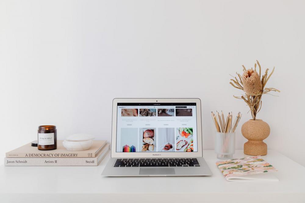 A woman works at her desk - home office A woman works at her desk - home office