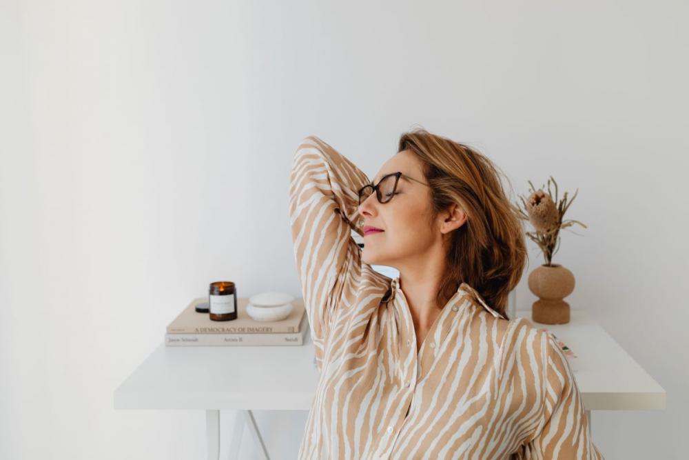 A woman works at her desk - home office A woman works at her desk - home office