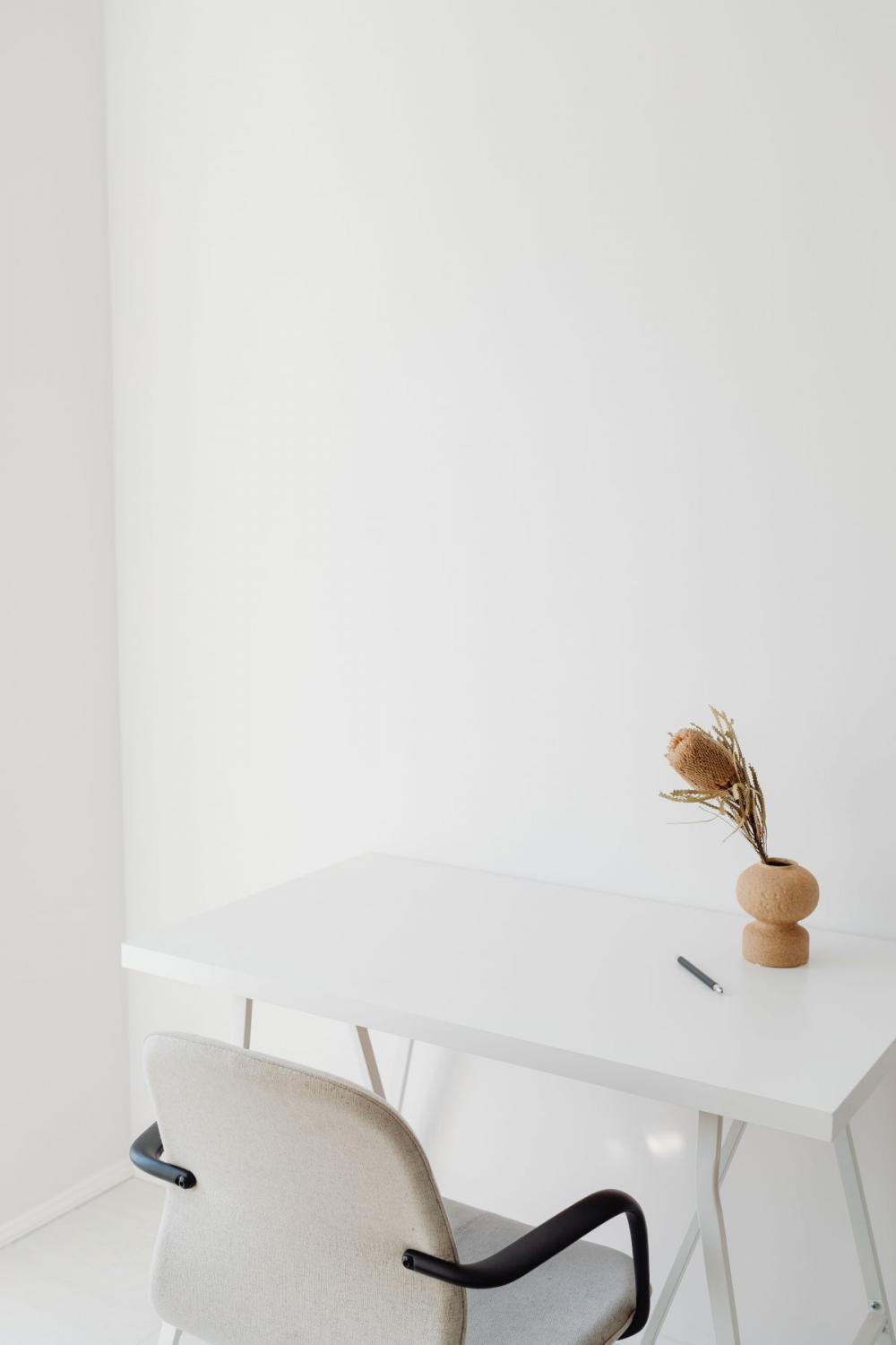 A woman works at her desk - home office A woman works at her desk - home office
