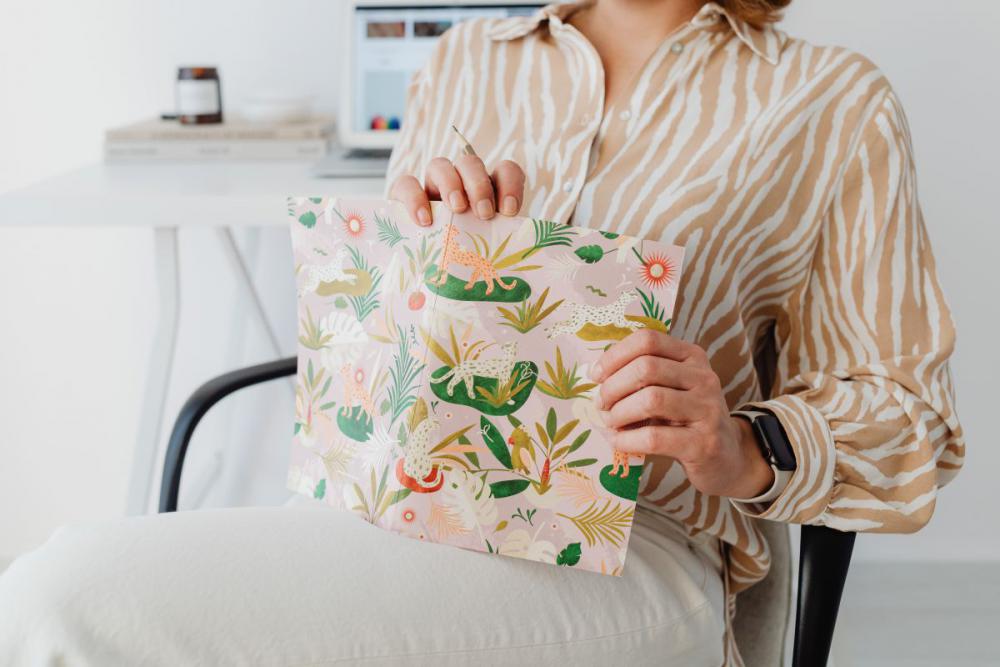 A woman works at her desk - home office A woman works at her desk - home office