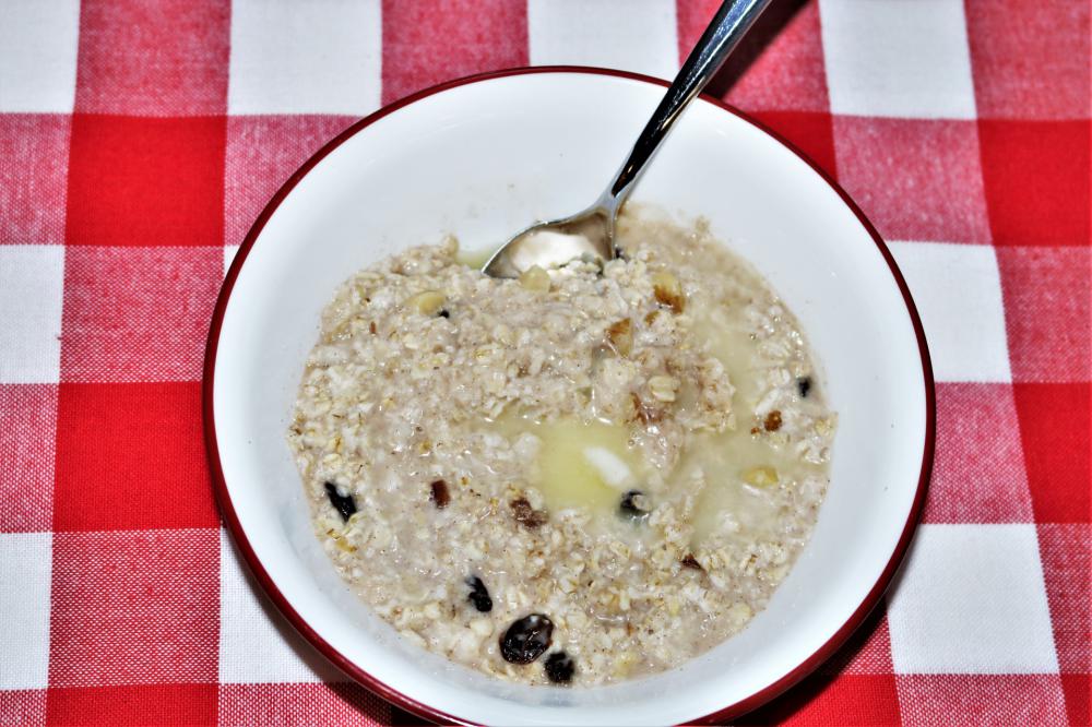 Bowl Of Oatmeal On Table Bowl Of Oatmeal On Table