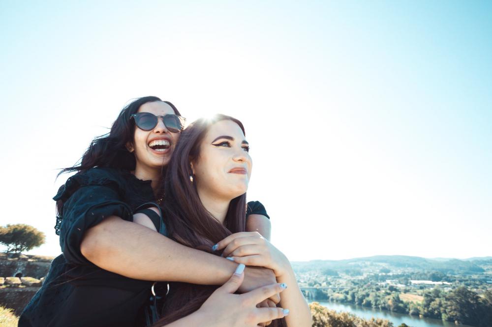 Two Women Look Out Into The Distance Together Photo Two Women Look Out Into The Distance Together Photo