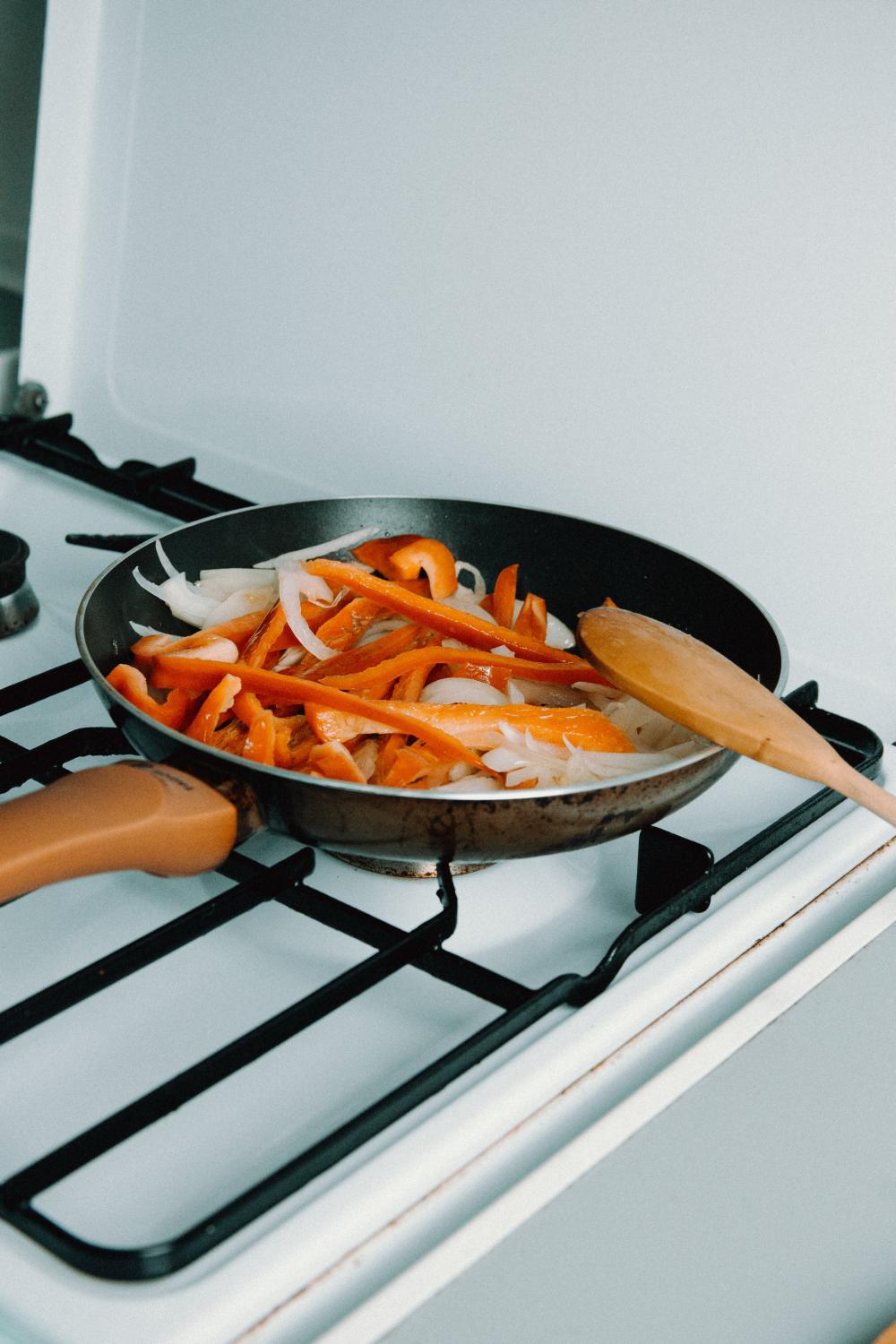 Stove Top And Pan Filled With Onions And Peppers Photo Stove Top And Pan Filled With Onions And Peppers Photo