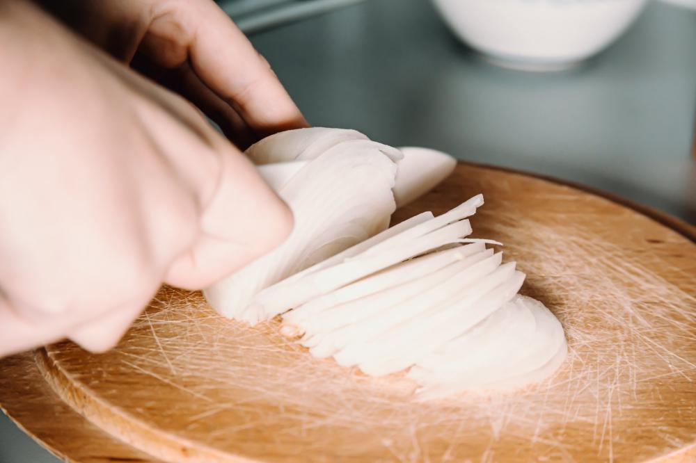 Close Up Of A White Onion Being Chopped Photo Close Up Of A White Onion Being Chopped Photo