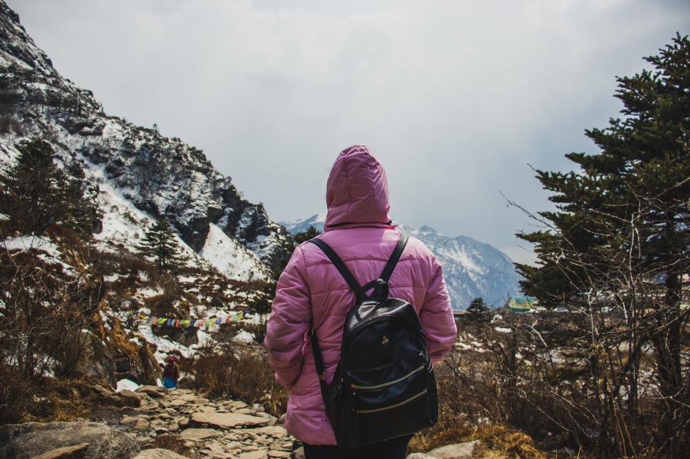 Person In Pink Hiking On A Mountain Trail Photo Person In Pink Hiking On A Mountain Trail Photo