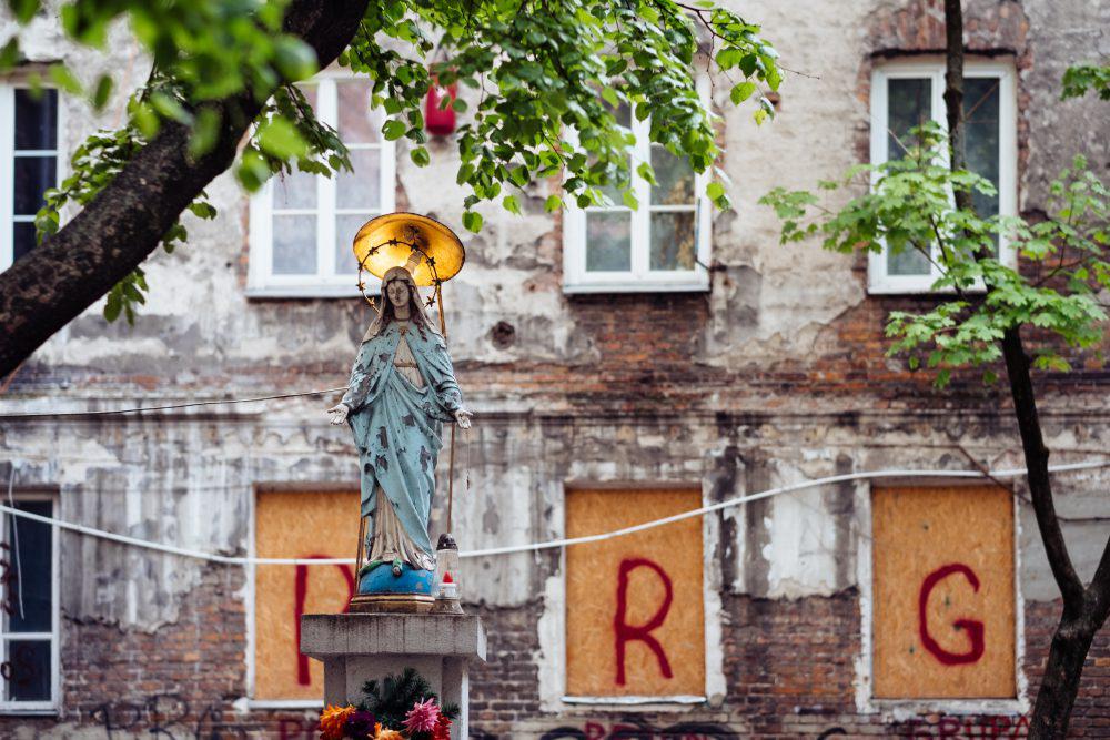 Catholic holy figure worship place outside a poor neighbourhood building 2 Catholic holy figure worship place outside a poor neighbourhood building 2