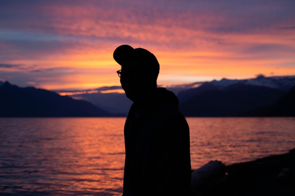 Person Silhouette Looking At A Sunset Photo Person Silhouette Looking At A Sunset Photo