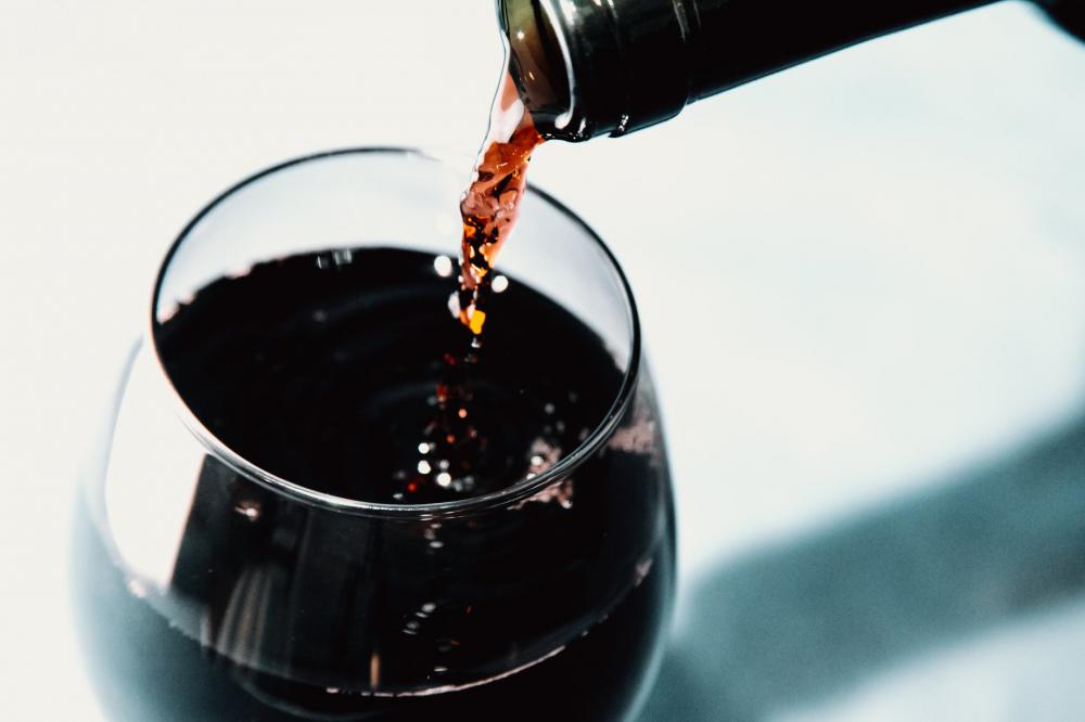 Red Wine Pouring Into A Wine Glass Photo Red Wine Pouring Into A Wine Glass Photo
