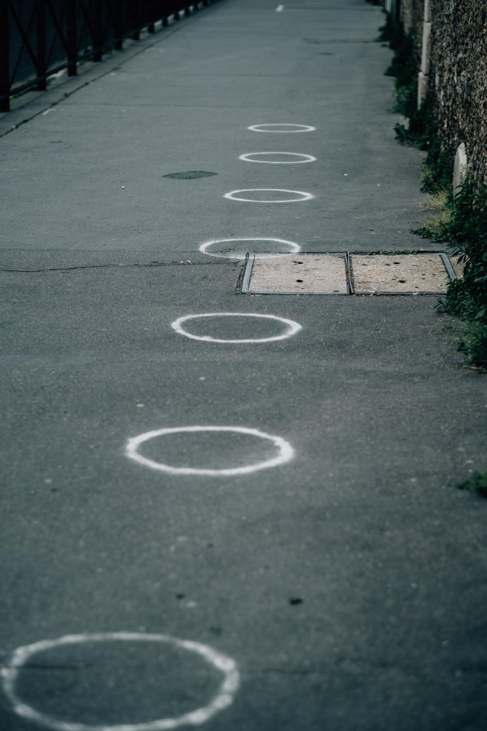 Paved Sidewalk With White Painted Circles Photo Paved Sidewalk With White Painted Circles Photo