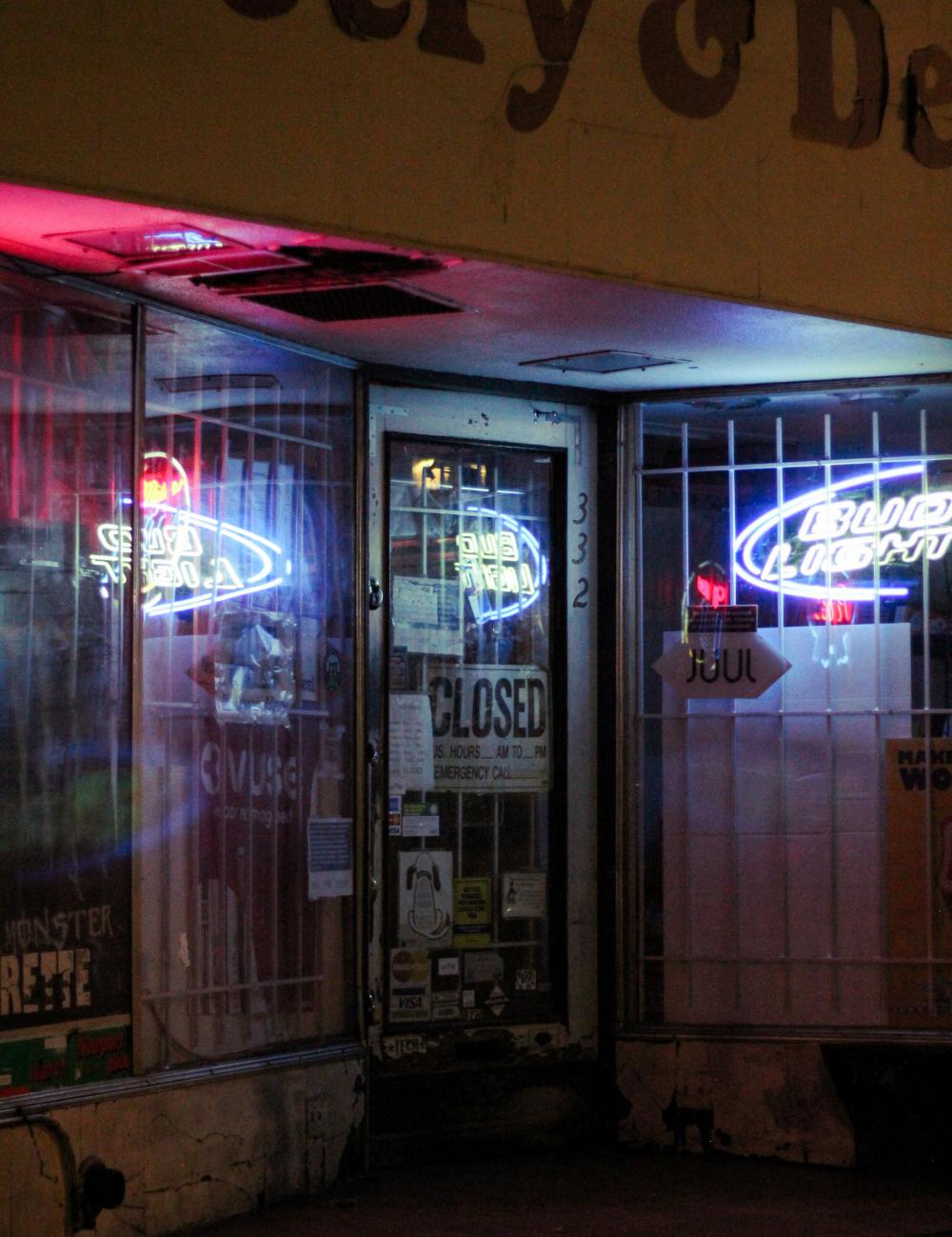 Closed Store Entrance With A Bright Neon Signs Photo Closed Store Entrance With A Bright Neon Signs Photo