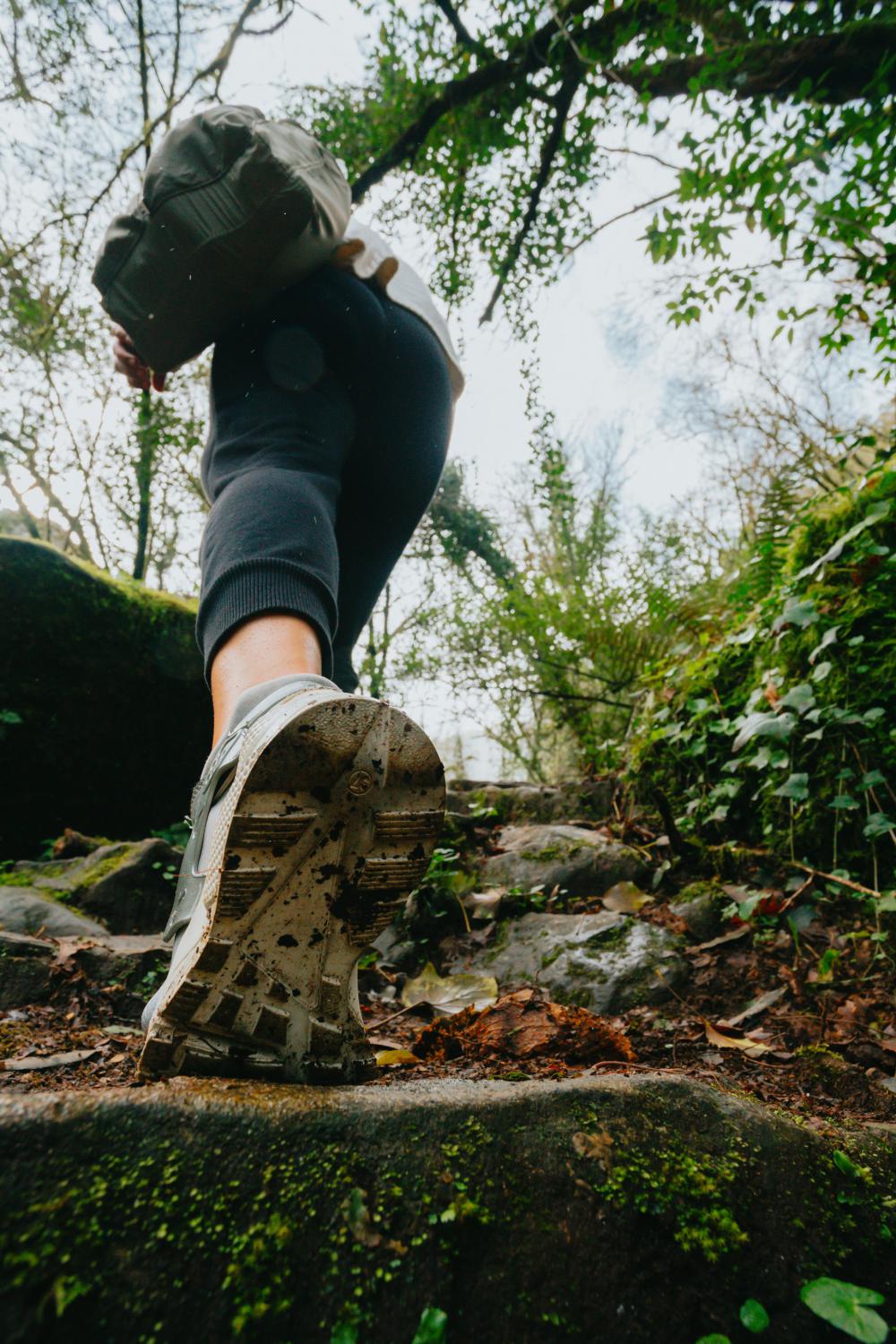 Low Angle View Of A Person Hiking Up A Stone Pathway Photo Low Angle View Of A Person Hiking Up A Stone Pathway Photo