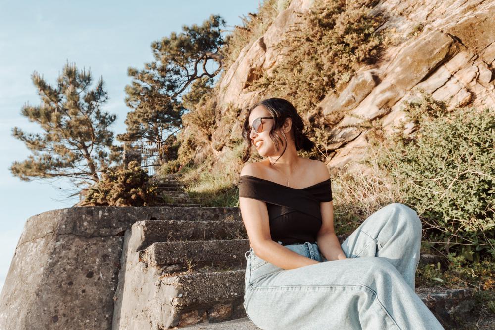 Woman In Sunglasses Sits On Stone Steps Photo Woman In Sunglasses Sits On Stone Steps Photo