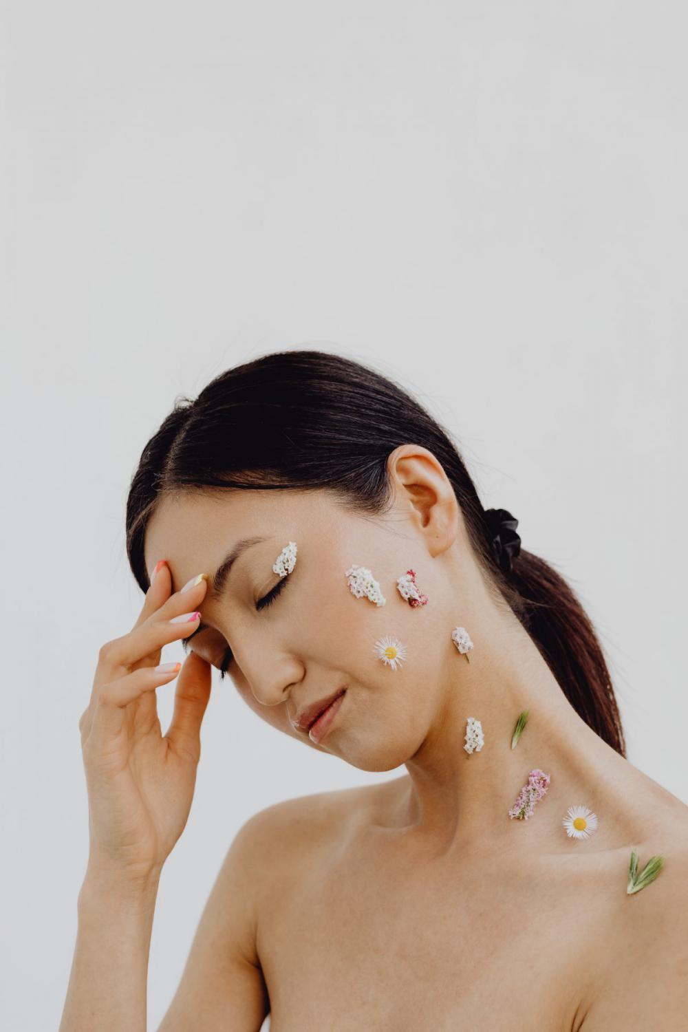 Sensual Portrait Of A Asian Woman With Flowers On Her Face Sensual Portrait Of A Asian Woman With Flowers On Her Face