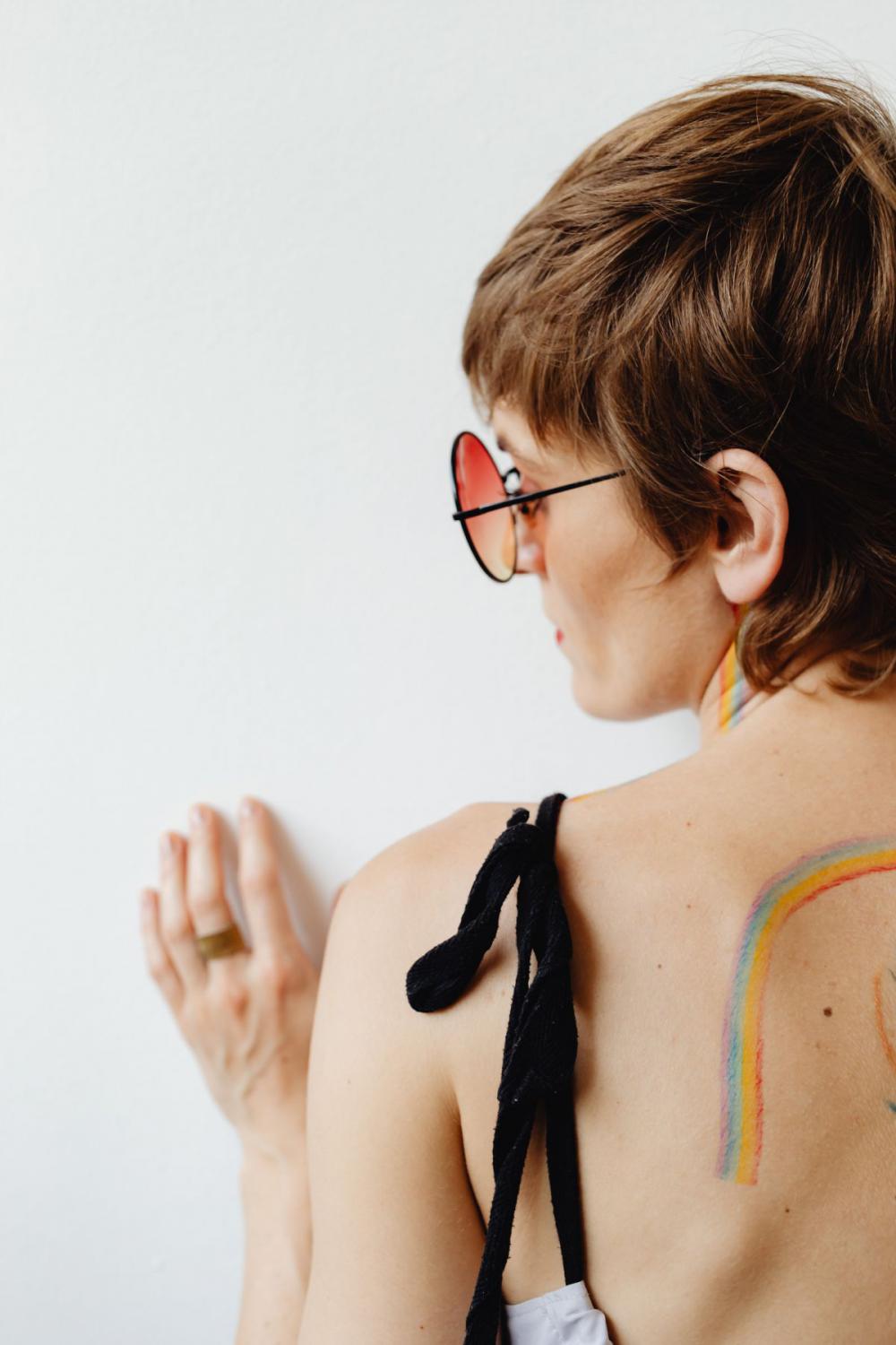 Girls paint an LGBT rainbow on their bodies Girls paint an LGBT rainbow on their bodies