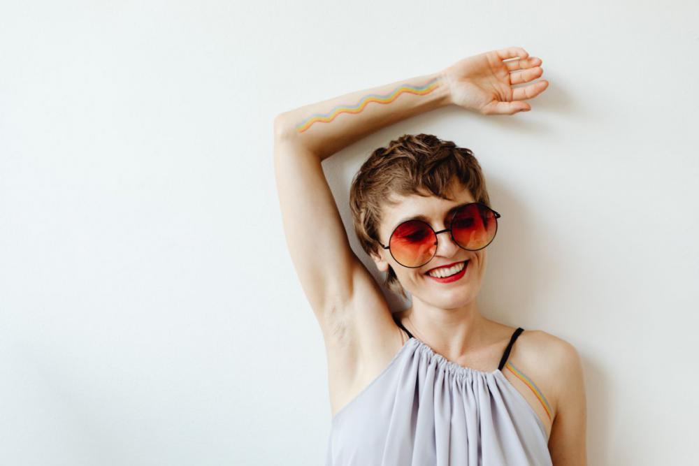 Girls paint an LGBT rainbow on their bodies Girls paint an LGBT rainbow on their bodies