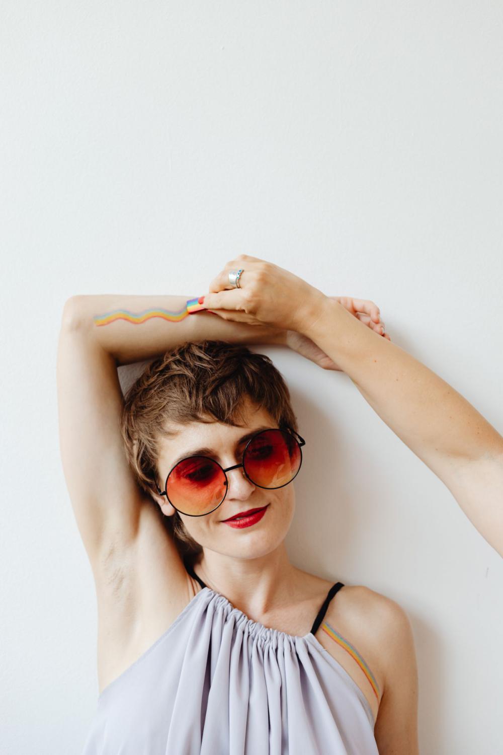 Girls paint an LGBT rainbow on their bodies Girls paint an LGBT rainbow on their bodies