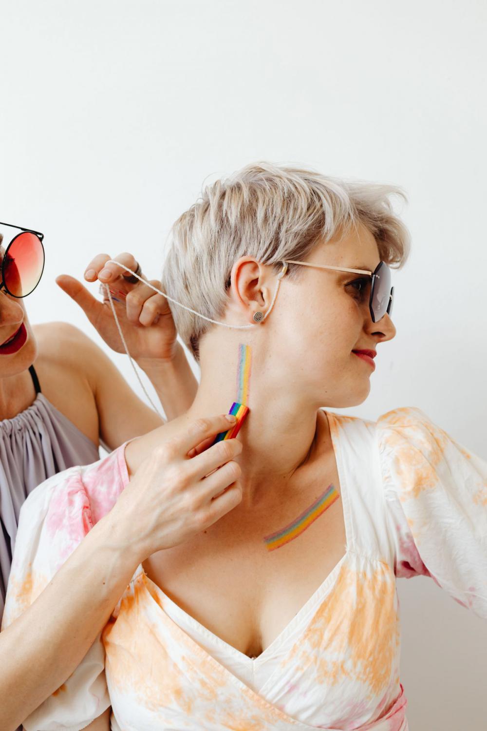 Girls paint an LGBT rainbow on their bodies Girls paint an LGBT rainbow on their bodies