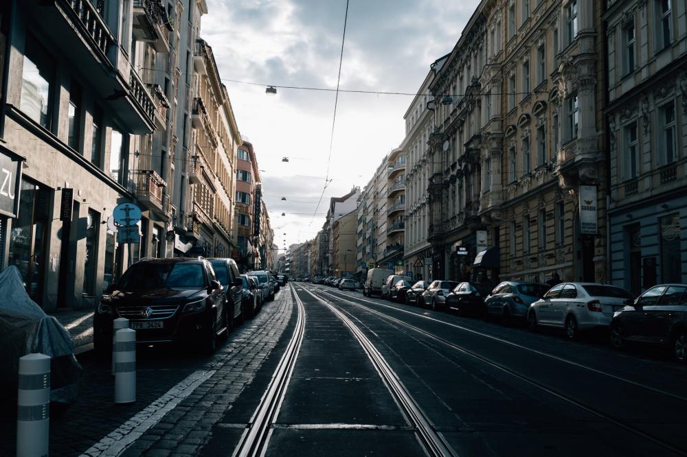 Parked Cars Line An Empty City Street Photo Parked Cars Line An Empty City Street Photo