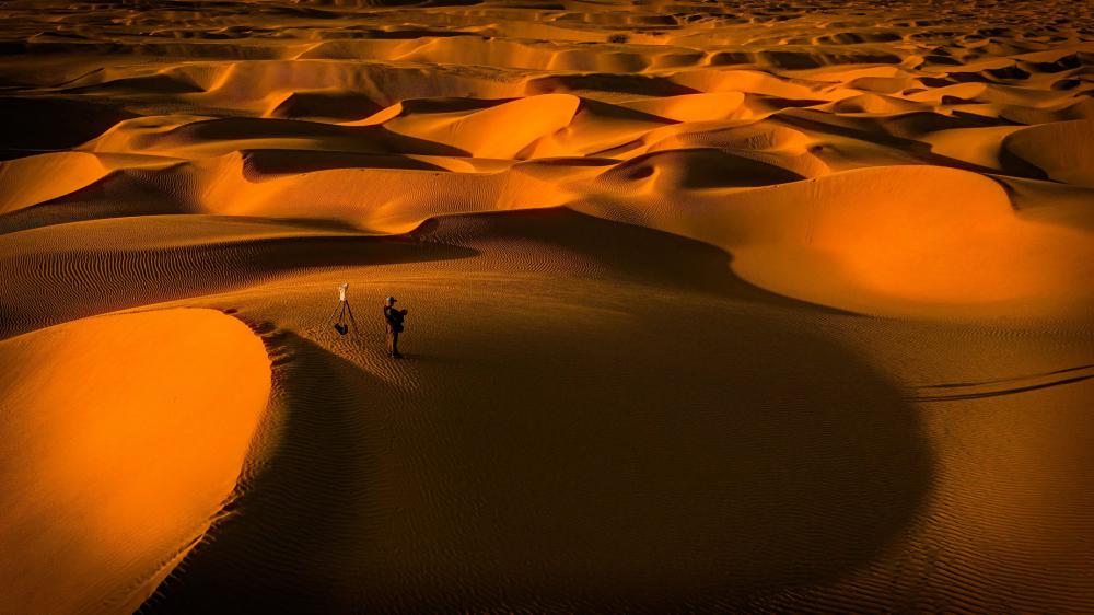 Landscape Of Sand Dunes With Photographer In View Photo Landscape Of Sand Dunes With Photographer In View Photo